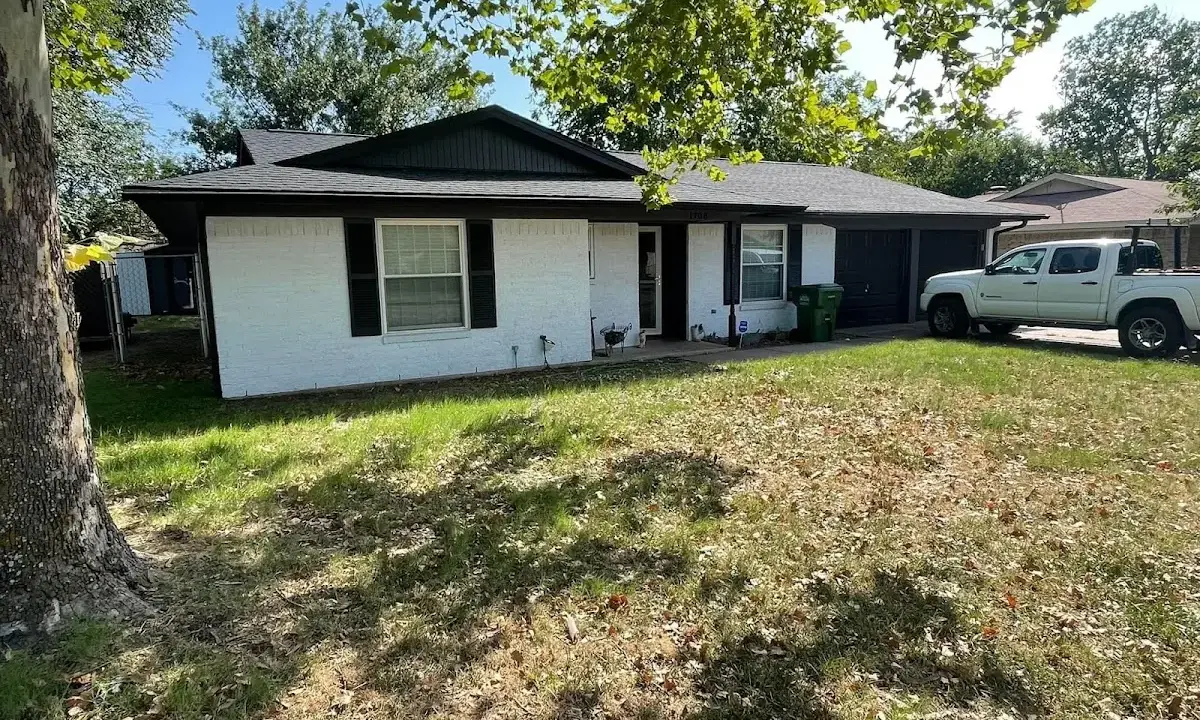 Professional roofing crew working on a residential roof in Warminster
